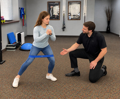 Patient performing progressive rehabilitation exercises at Northwood Chiropractic in Maple Grove, MN